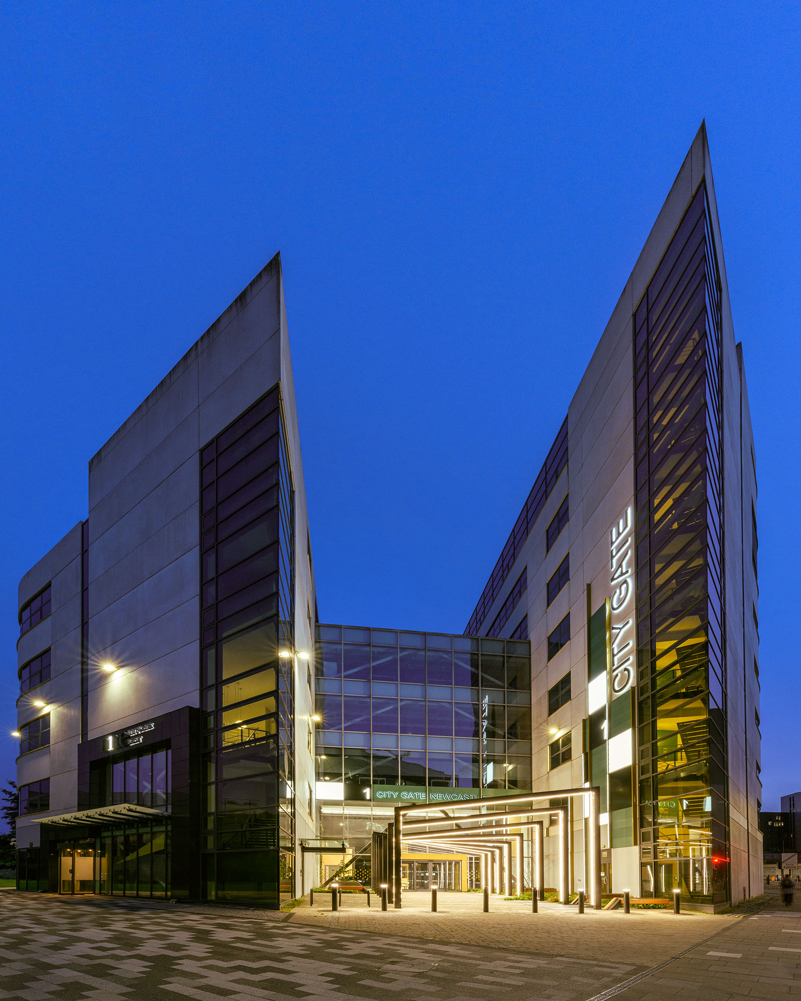 Commercial office exterior in Newcastle upon Tyne at dusk with lighting