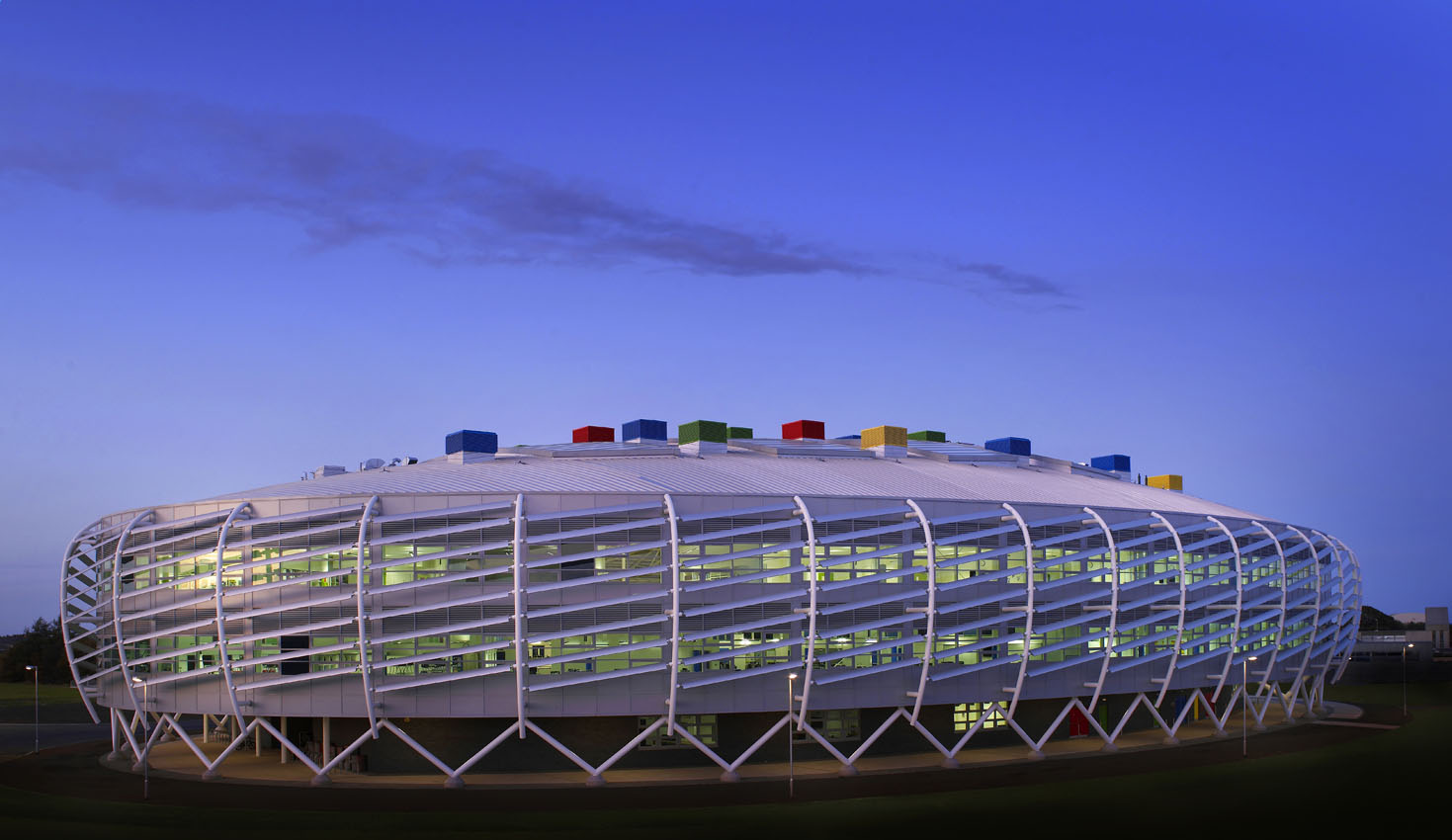 Architectural exterior of a school building at dusk