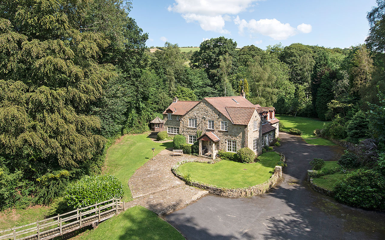 Residential property taken from a mast showing gardens and setting
