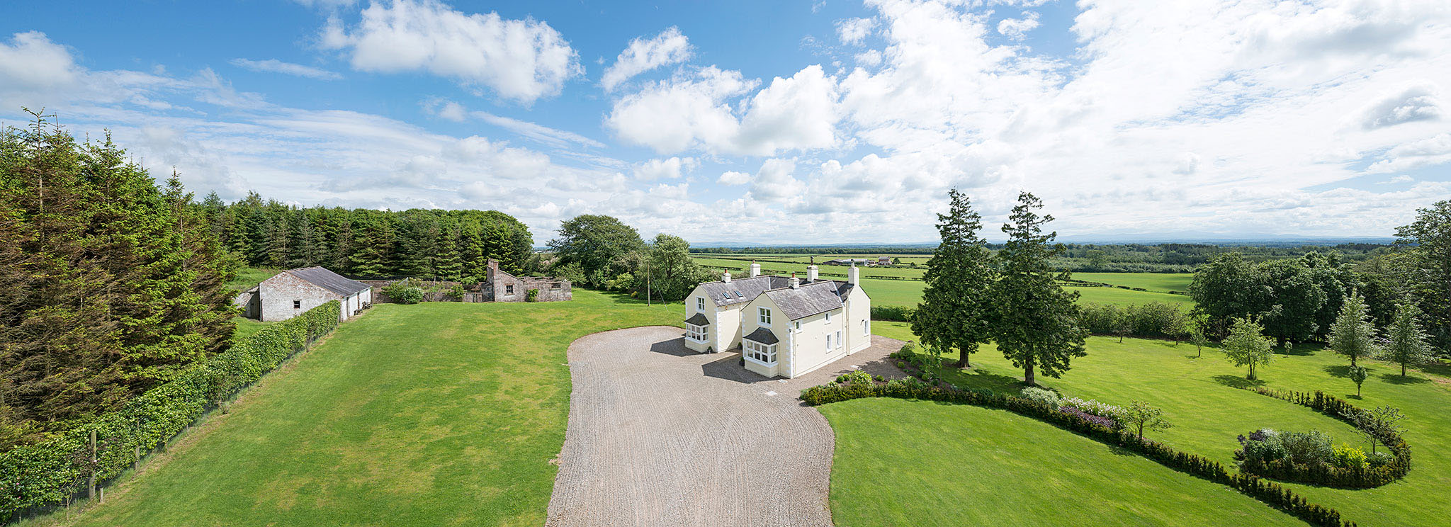 Residential property taken from a mast showing gardens and setting