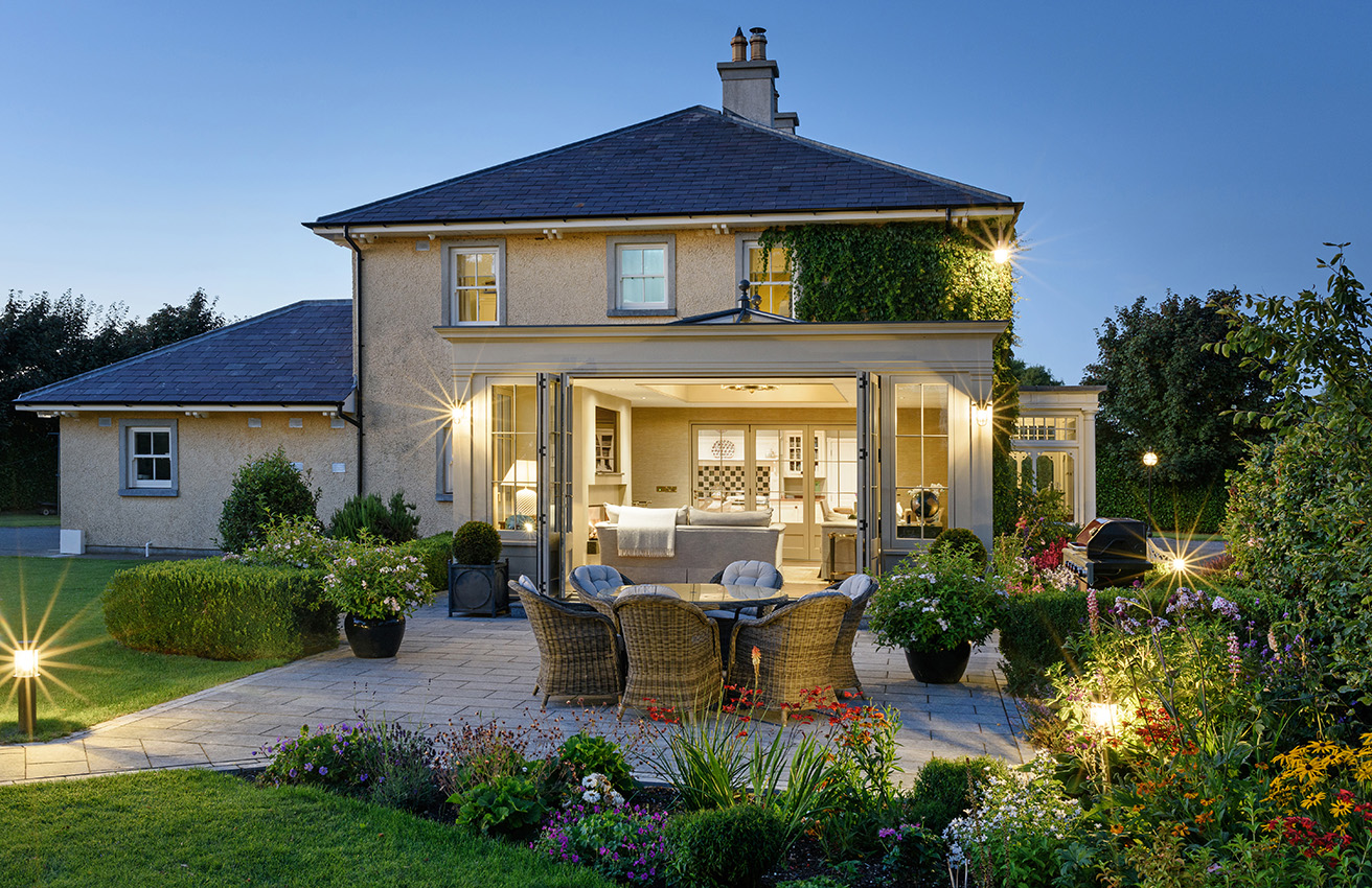 Orangery exterior at dusk with lighting