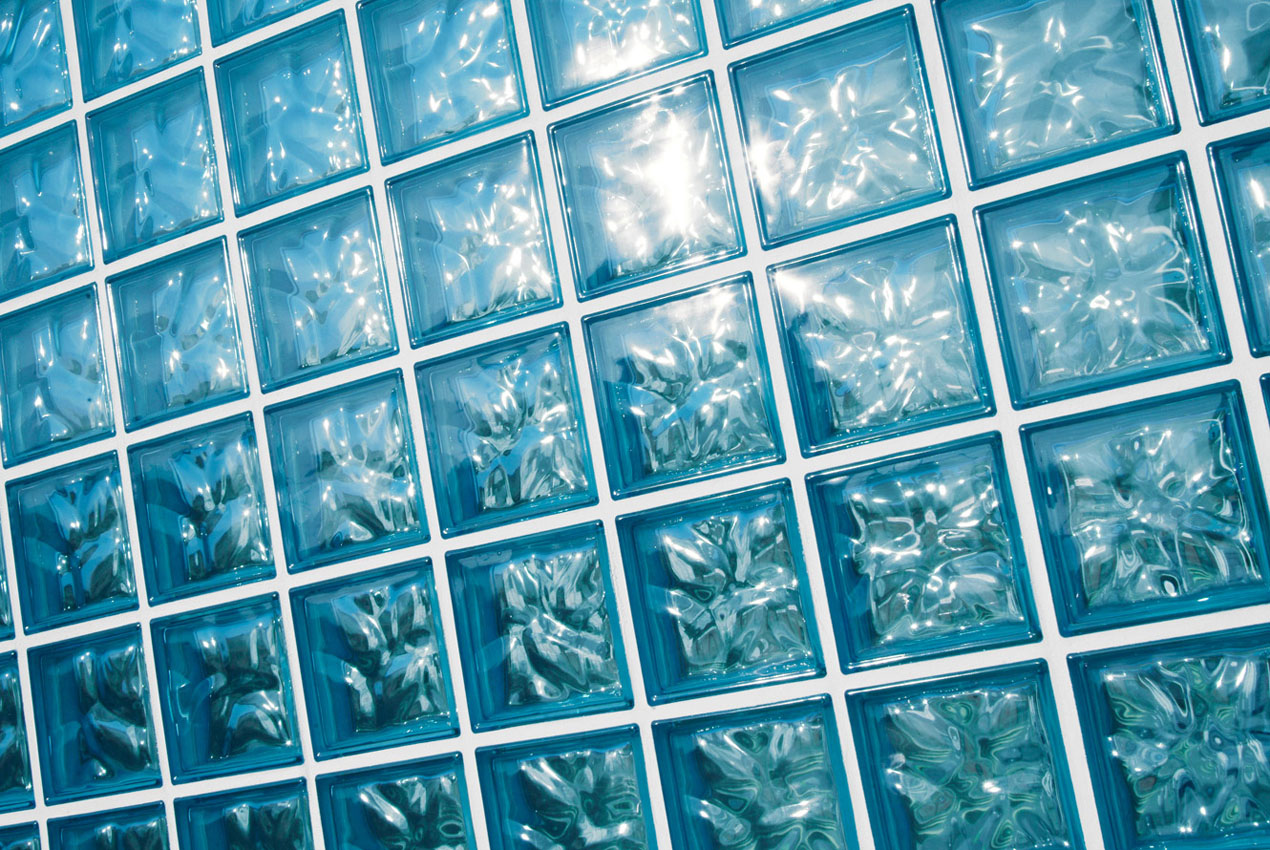 Glass block wall detail with a blue colour tint