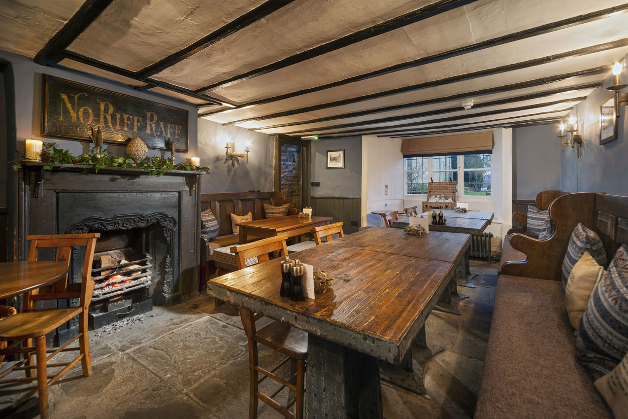 Hotel interior with partially exposed beams and wooden furniture