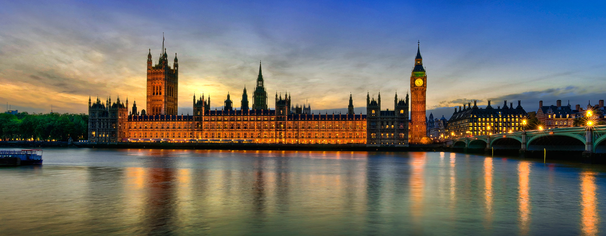 River Thames and Westminster at dusk with dramatic sky