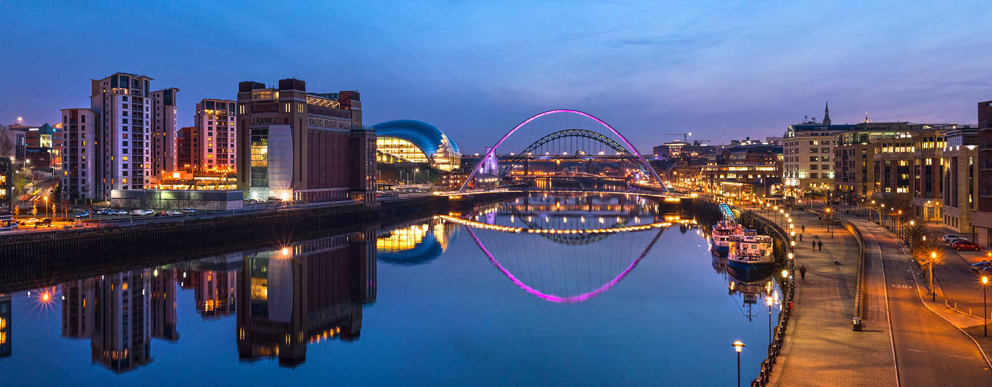 Panorama or the Newcastle Quayside and Gateshead at dusk overlooking the river Tyne