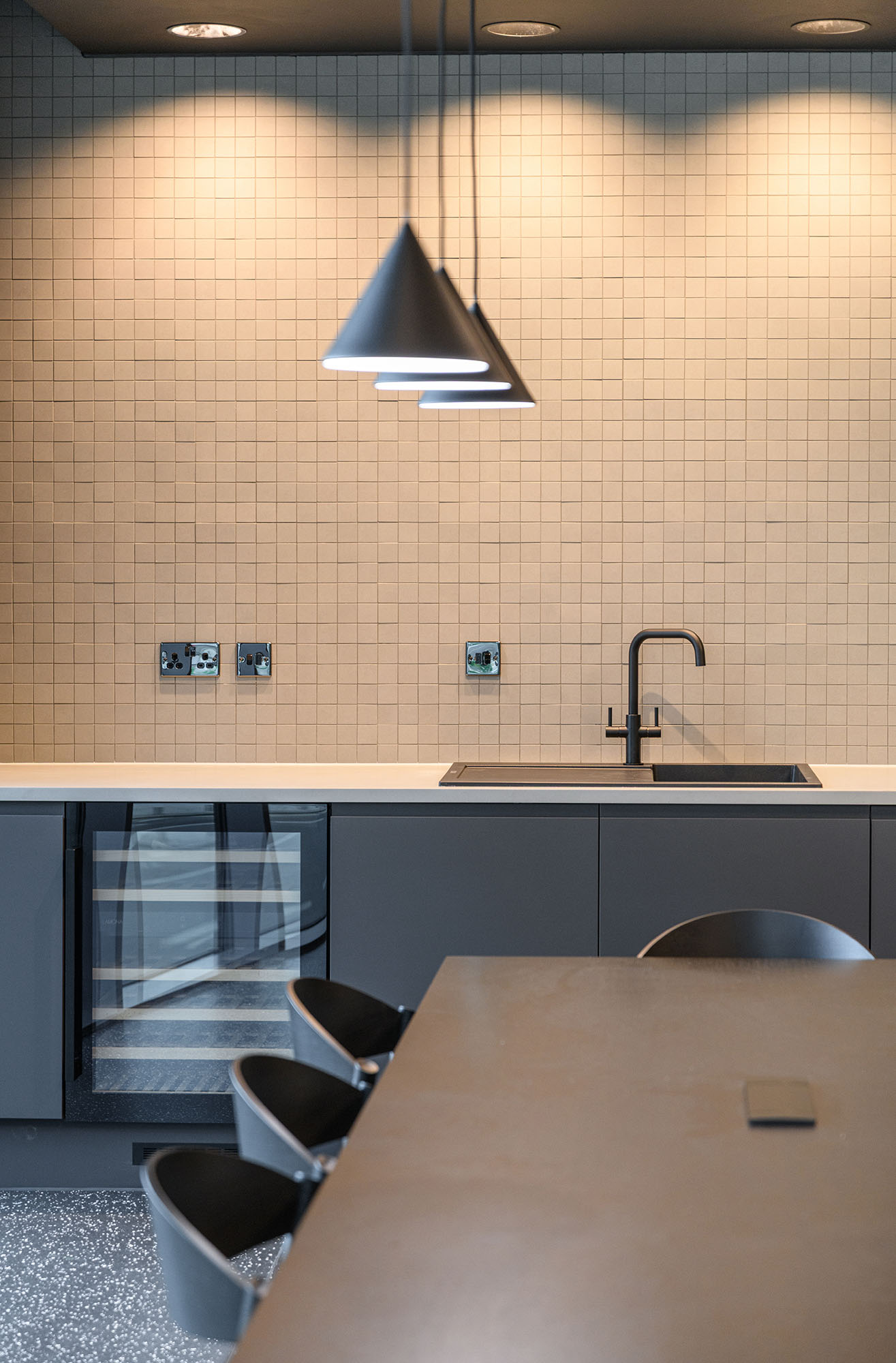 Office seating and tiles wall with kicthen tile detail