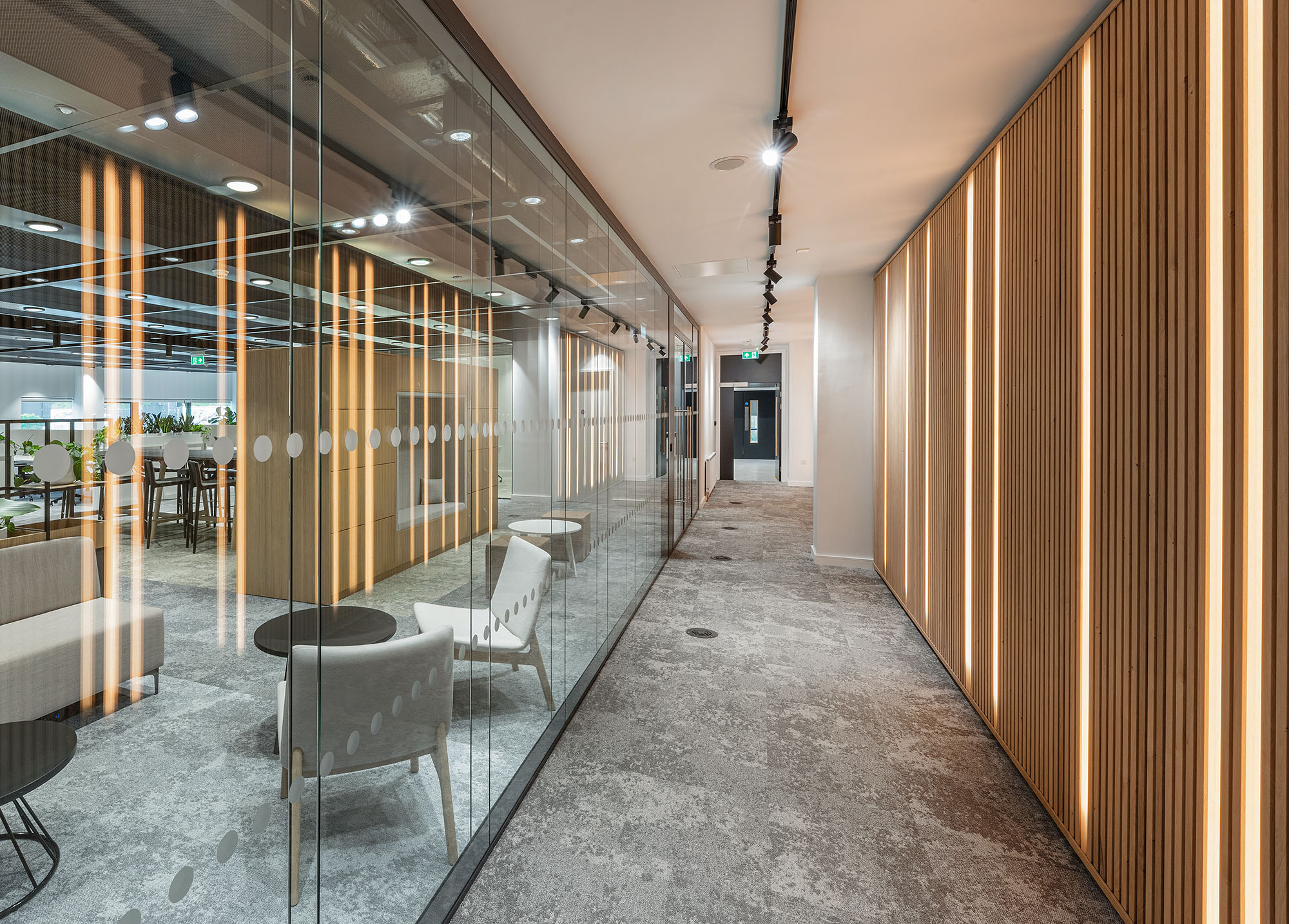Office entrance with wood walls and glass partition