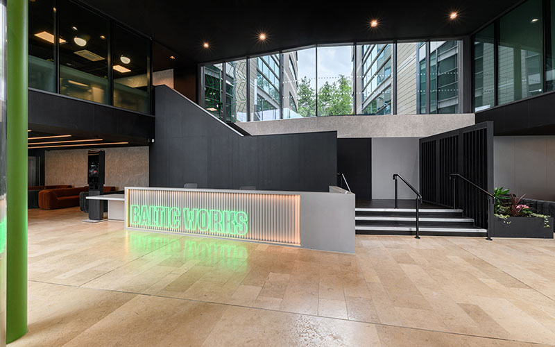 Interior space and office reception area with neon sign and tiled floor