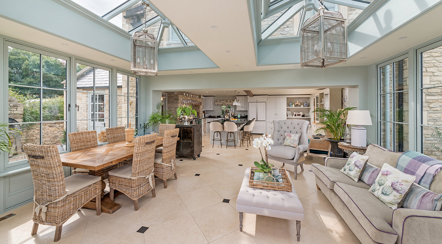 Interior of an orangery in summer with open plan kitchen