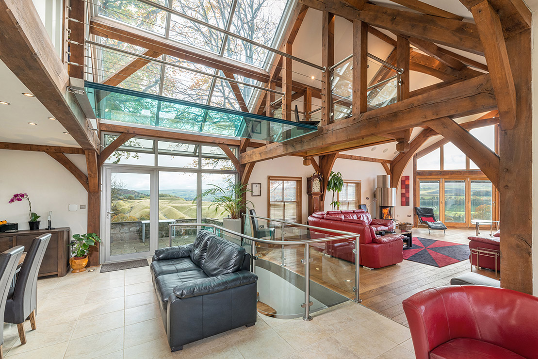 Property interior with exposed beams and glass ceiling